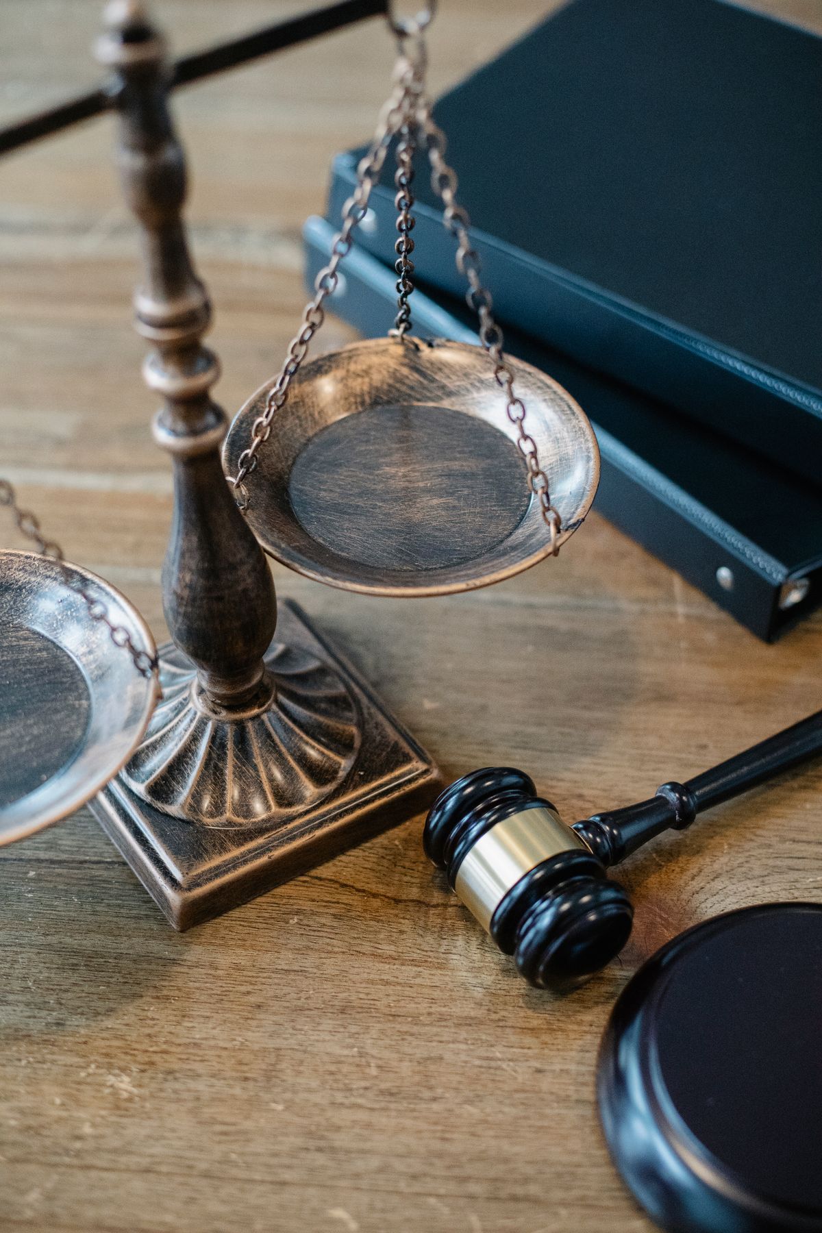 Scales of justice and a gavel on a desk representing legal dispute resolution
