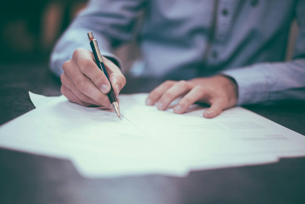 Close-up of a formal business contract ready for signature
