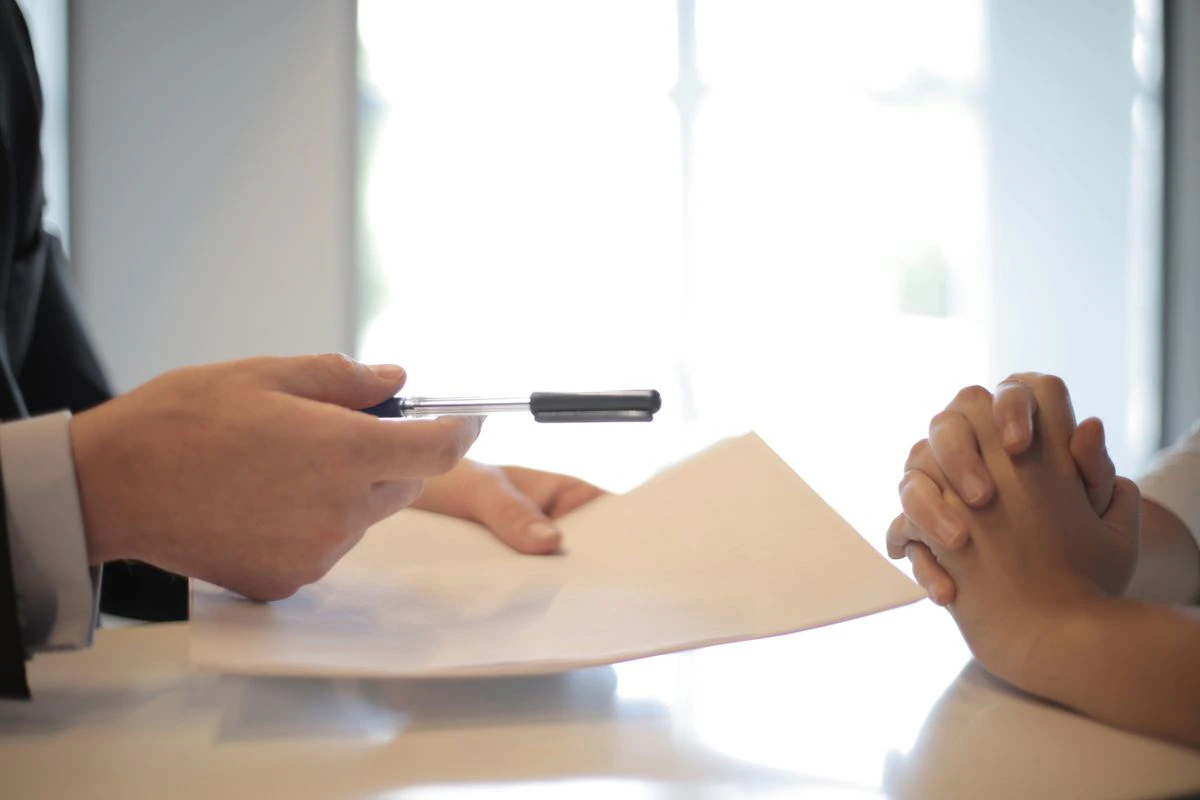 Two business professionals reviewing legal documents together